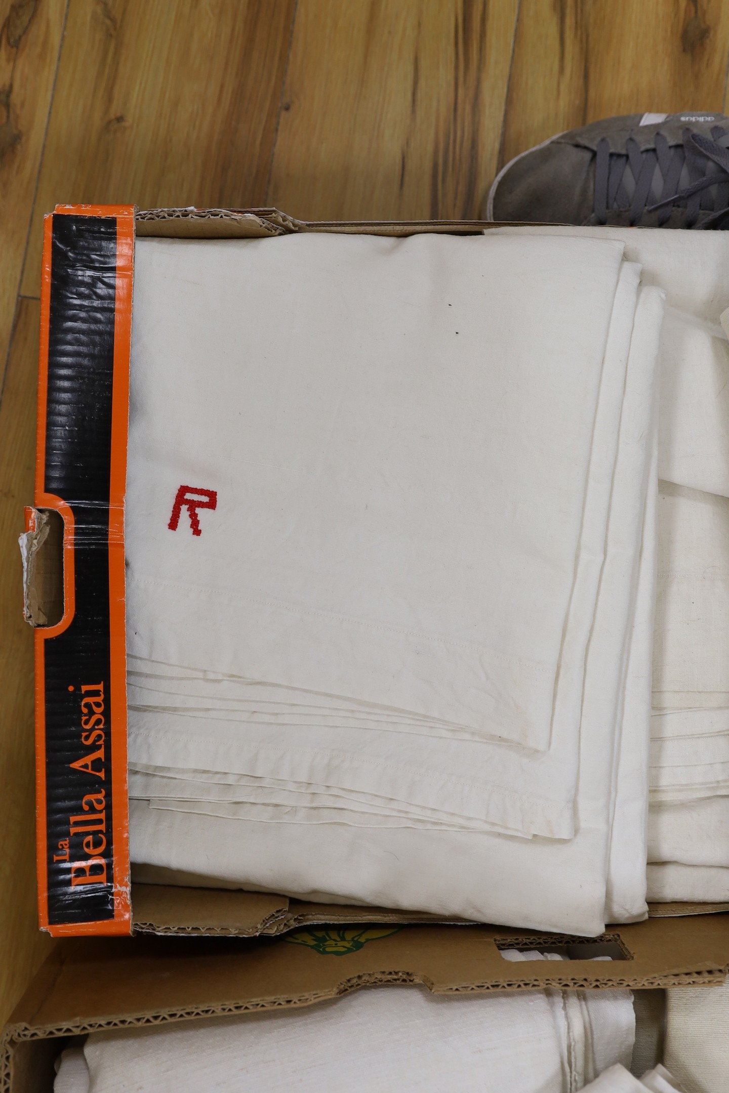 Two boxes of French Provincial linen sheets, some with red monograms